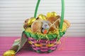 Golden foil chocolate eggs with cute Easter bunny decoration and hot cross buns