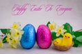 Colorful Easter chocolate eggs and flowers Royalty Free Stock Photo