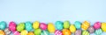 Easter Egg bottom border over a pastel blue banner background