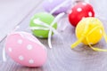 Colorful easter egg decoration on wooden background