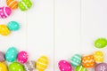 Colorful Easter Egg frame or corner border over a white wood background