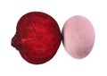 Colorful Easter egg painted with natural dye and cut beet on white, top view Royalty Free Stock Photo