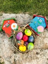Colorful Easter egg and sand green grass background and small wooden house Royalty Free Stock Photo