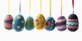 Easter egg shaped cotton thread handcrafts hanging from top. Concept of happy easter day