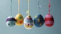 Easter egg shaped cotton thread handcrafts hanging from top. Concept of happy easter day