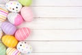 Colorful Easter Egg side border over a white wood background Royalty Free Stock Photo