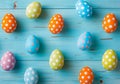 Colorful Easter egg side border against blue wood background Royalty Free Stock Photo