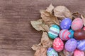 Colorful Easter egg side border against a rustic wood Vintage pa Royalty Free Stock Photo