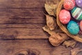 Colorful Easter egg side border against a rustic wood Vintage pa Royalty Free Stock Photo