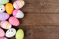 Colorful Easter Egg side border over a rustic wood background Royalty Free Stock Photo