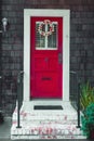 Colorful easter egg wreath on a front red door. Royalty Free Stock Photo