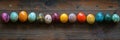Colorful Easter eggs arranged artistically on a rustic wooden surface during spring celebrations Royalty Free Stock Photo