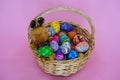 The colorful Easter eggs in the basker pink background Royalty Free Stock Photo