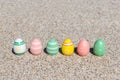 Colorful Easter eggs on the beach in sunny day. Royalty Free Stock Photo