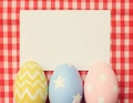 Colorful easter eggs and blank note paper Royalty Free Stock Photo