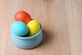 Colorful Easter eggs in a blue bowl. Easter eggs are a symbol and a mandatory attribute of Easter Royalty Free Stock Photo