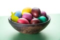 Colorful Easter eggs in bowl. Attribute of Easter celebration Royalty Free Stock Photo