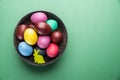 Colorful Easter eggs in bowl. Attribute of Easter celebration