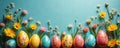Colorful Easter eggs with floral patterns on blue background. Flowers and Easter eggs. Easter celebration. Spring holiday decor. Royalty Free Stock Photo