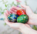 Colorful easter eggs in girl hands