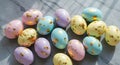 Colorful Easter Eggs with Gold Leaf on Gray Textured Surface Royalty Free Stock Photo
