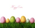 Colorful easter eggs on green grass isolated on white Royalty Free Stock Photo