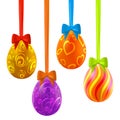Colorful easter eggs hanging on ribbons with bows