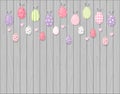 Colorful Easter eggs hanging on Wooden background - cartoon style Royalty Free Stock Photo