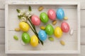 Colorful Easter eggs with letters on white planks Royalty Free Stock Photo