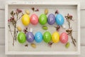 Colorful Easter eggs with letters on white planks Royalty Free Stock Photo