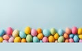Colorful Easter eggs on light blue background. Colored Egg Holiday background. Easter banner or postcard Royalty Free Stock Photo