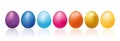 Colorful easter eggs line with reflection on a white surface. Spring easter banner.