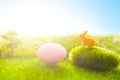 Colorful easter eggs on meadow over bright spring sky