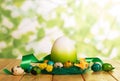 Colorful Easter eggs in nest and near, one large, ribbon. Royalty Free Stock Photo