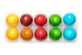 Colorful Easter eggs, colored Paschal eggs in a clear plastic egg box