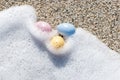 Colorful Easter eggs on the seaside in sunny day. Royalty Free Stock Photo