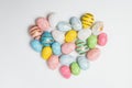 Colorful Easter eggs in shape of heart. Top view, close up. Happy Easter Royalty Free Stock Photo