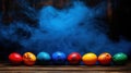 Colorful Easter eggs smoky backdrop wood Royalty Free Stock Photo