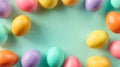 Colorful Easter eggs are spread out on a soft pastel background, creating an inviting scene for decorations or messages. The Royalty Free Stock Photo