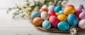 Colorful Easter eggs on white wooden table. Royalty Free Stock Photo