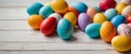 Colorful Easter eggs on white wooden table. Royalty Free Stock Photo