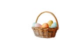 Colorful Easter eggs in wicker basket, isolated on transparent background - festive tradition