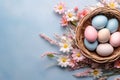 Colorful Easter Eggs in Wicker Basket with Spring Flowers Royalty Free Stock Photo