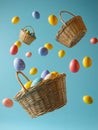 Colorful Easter Eggs in Wicker Baskets Against Blue Background Royalty Free Stock Photo