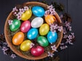 Colorful Easter eggs in a wooden bowl Royalty Free Stock Photo