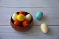 Colorful Easter eggs in wooden bowl Royalty Free Stock Photo