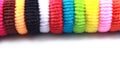 Colorful elastic hair bands with empty space on isolated white background.