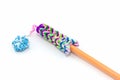 Colorful elastic rainbow loom bands with pencil.