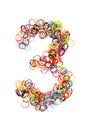 Colorful elastic rubber bands shape Number three Royalty Free Stock Photo