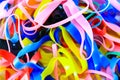 Colorful elastic rubber bands on white texture background Royalty Free Stock Photo